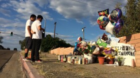 Kevin Pacheco, 17, and Romeo De la Cruz, 18, visit a memorial for Jonathan Cortez on Oct. 12, 2015. Cortez was killed in a hit and run Oct. 9, 2015 near the intersection of 54th and Lea streets.