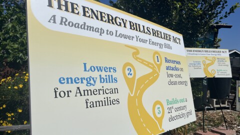 A sign detailing the Energy Bills Relief Act stands at the Solana Center for Environmental Innovation in Encinitas, March 23, 2026.