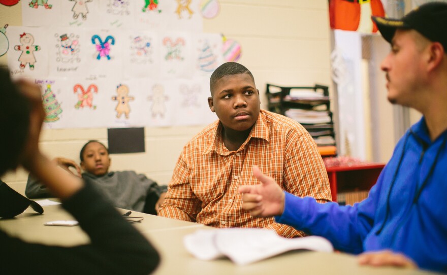 Jim Courtney-Clarks, 15, talks with Army veteran Alberto Bóleros during the Urban Warriors program in December. The Chicago program is designed to bring together veterans and youth who have been exposed to the city's violence.