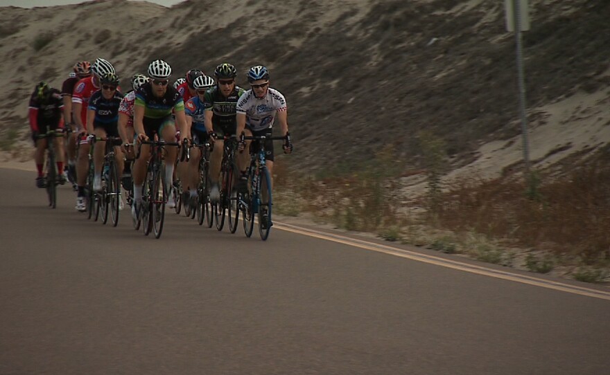 Cyclists ride in a group around Fiesta Island in the afternoon on July 1, 2014.