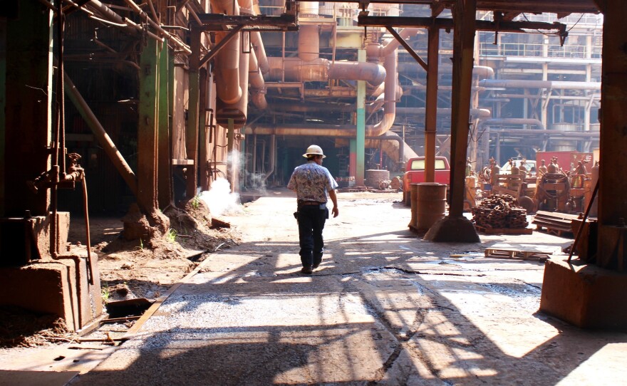 Robert Luuwai, the vice president of HC&S, walks through the sugar mill on Maui for one of the last times.