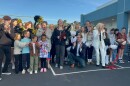 Students cut the ribbon to mark the official completion of a modernization project at Pacific Beach Elementary School on Feb. 2, 2025.