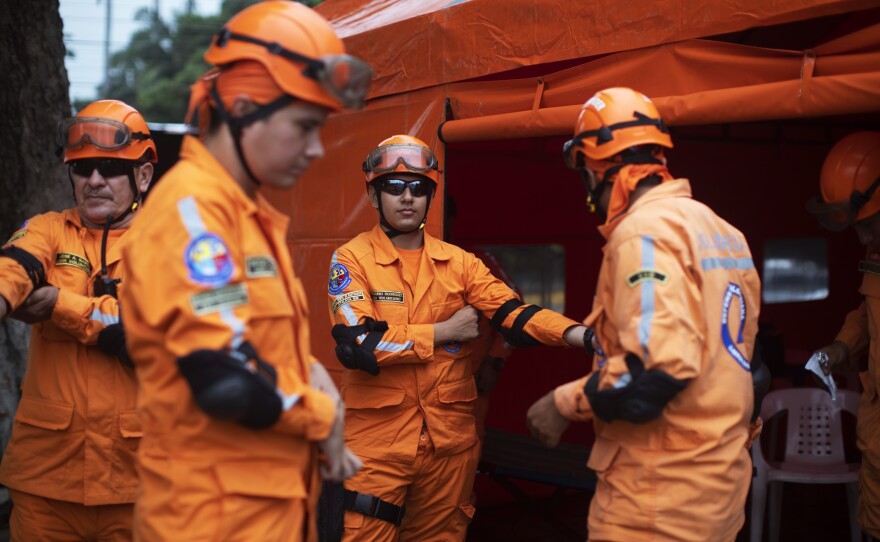 Medics wait at the Colombian side of the bridge to assist with health needs.