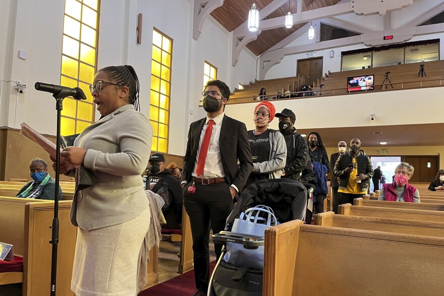File photo of people lining up to speak during a reparations task force meeting at Third Baptist Church in San Francisco on April 13, 2022.