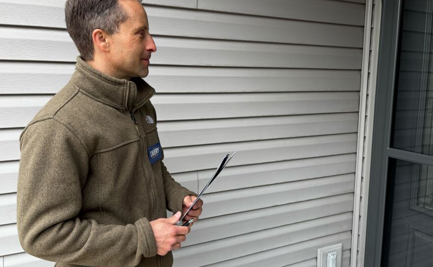 Indiana state Sen. Spencer Deery waits to speak to a voter as he goes door-to-door campaigning for re-election ahead of Indiana's primary where he faces a President Trump-backed challenger and millions spent to defeat him and other Republicans who voted against redistricting in the state.