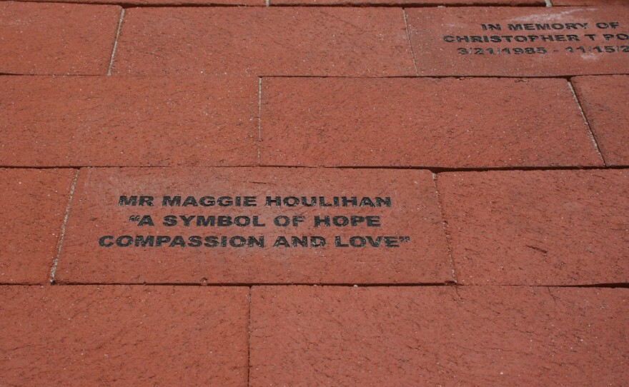 Memorial bricks, like this one for former Encinitas city councilwoman Maggie Houlihan, are being sold at the foot of the Surfing Madonna mosaic as a community fundraiser.