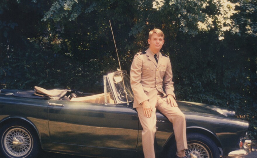 Armistead Maupin sitting on a convertible. (undated photo)