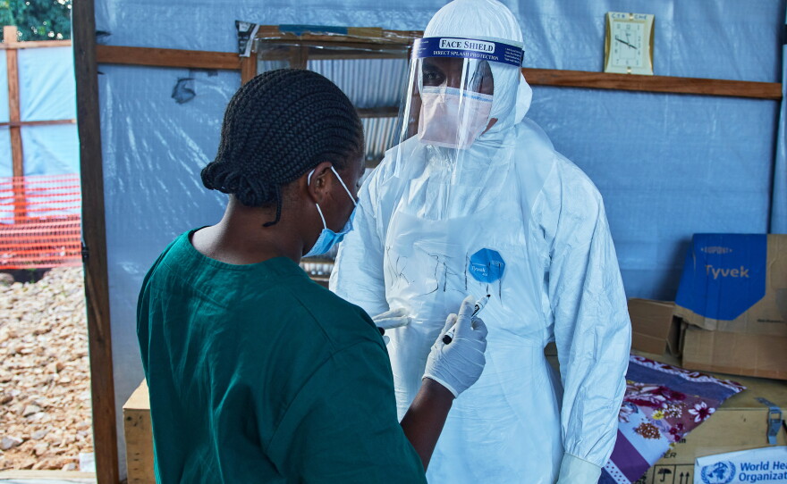 Health workers interact at the Evangelical Medical Center, in Bunia, eastern Congo, Friday, July 3, 2026, where Ebola clinical trials are scheduled to take place.