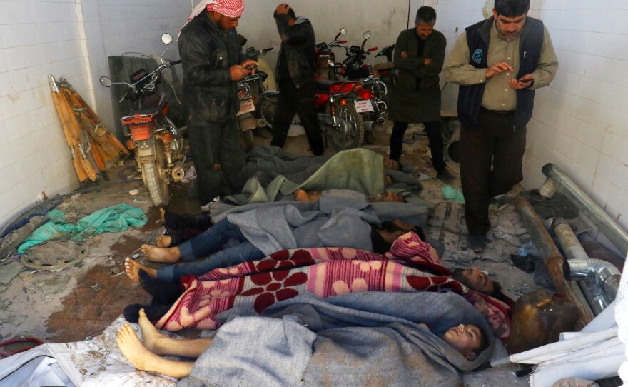 Bodies are wrapped in blankets after a suspected chemical attack in the town of Khan Shaykhun on Tuesday.