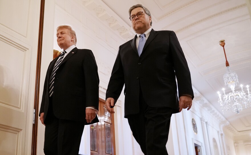 President Trump and Attorney General William Barr attend an event at White House on Wednesday. Trump has empowered Barr to investigate the origins of the special counsel probe and reveal his findings.