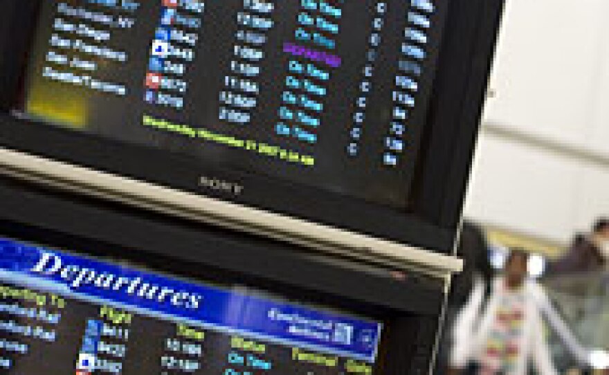 Monitors show departing flights at Newark Airport in Newark, N.J., on Wednesday. The three New York-area airports were expecting to serve 1.7 million travelers on the day before Thanksgiving.