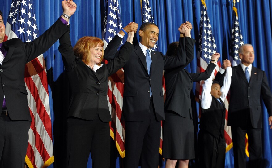 President Barack Obama celebrates with lawmakers after signing into law the Patient Protection and Affordable Care Act health insurance bill in March 2010.