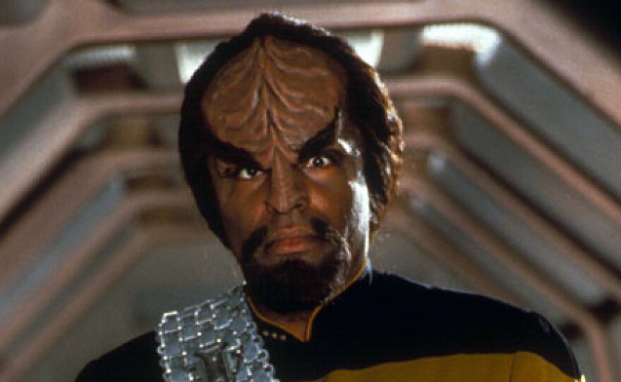 A Klingon from Star Trek. A linguist created the Klingon language used in the television series and films.  