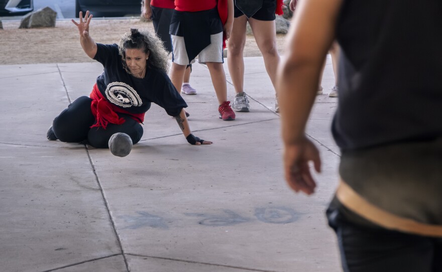 Michel'le Sepu'lveda dives for the sacred sphere at Chicano Park on Friday, July 21, 2023.