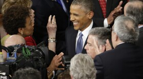 President Barack Obama is greeted on Capitol Hill in Washington before his State of the Union address, Jan. 20, 2015.