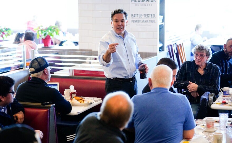 GOP Senate candidate McCormick meets with attendees during a campaign event in York, Pa., on April 4.