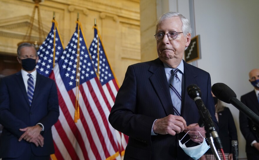 Senate Minority Leader Mitch McConnell, R-Ky., joined by Senate Minority Whip John Thune, R-S.D., left, has argued that President Biden is not governing like the moderate he campaigned as in 2020.