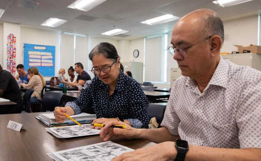 Students work on an assignment during an English as a second language class at the San Diego Continuing Education Mid-City campus in San Diego on Oct. 6, 2023.