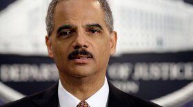 Attorney General Eric Holder speaks during a news conference at the Justice Department in Washington, Friday, Nov. 13, 2009, where he announced that the alleged attacker of USS Cole and four others to be tried by military commission.