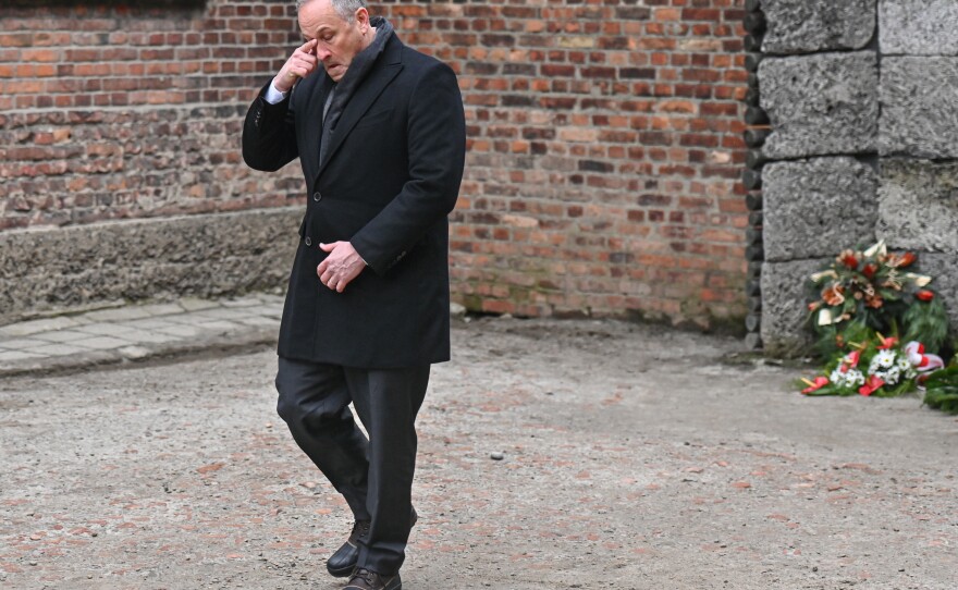 Emhoff reacts after laying wreaths honoring Holocaust victims at the former Auschwitz I site on January 27, 2023 in Oswiecim, Poland.