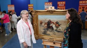 At the ANTIQUES ROADSHOW event in Minneapolis, the owner (left) of this circa 1885 heirloom oil painting by Russian artist Franz Roubaud gasps when appraiser Betty Krulik tells her the hot Russian art market is responsible for the work’s value of $100,000.