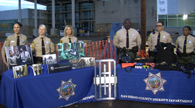 San Diego County Sheriff's employees stand behind recruitment tables during a media tour of the new San Diego County Women's Detention Facility, February 3, 2014. 