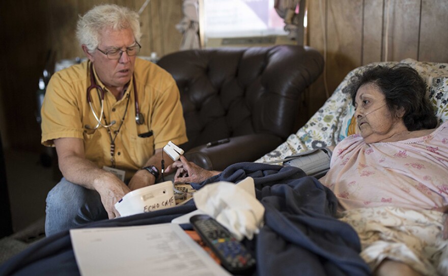Nurse Practitioner Chris Ruge during a home visit with a patient in Las Vegas, N.M.