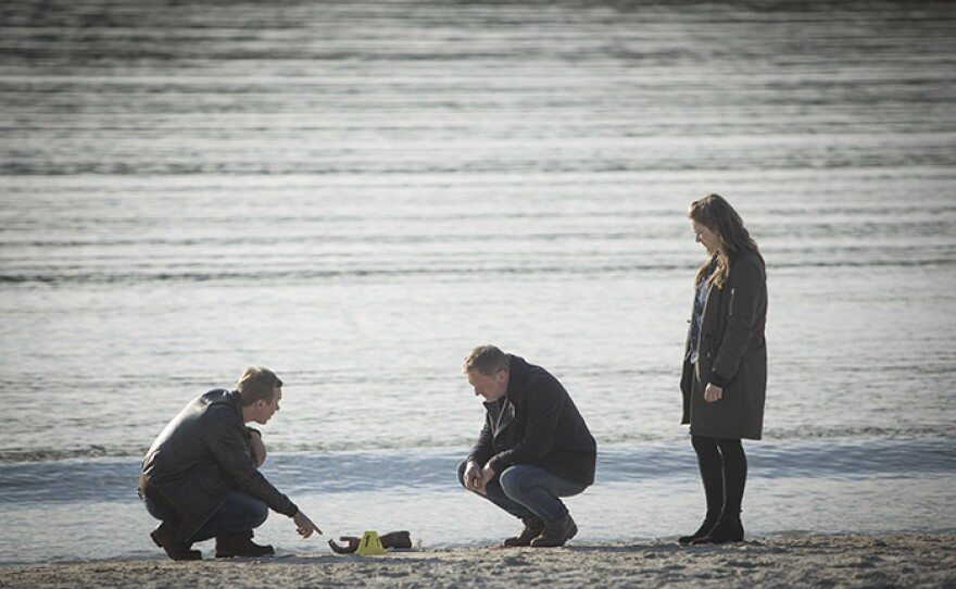 A severed hand washes up on a beach in a scene from SHETLAND Season 5.