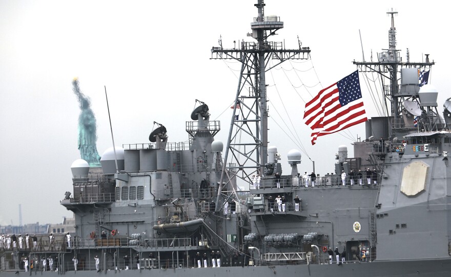 The USS San Jacinto passes by the Statue of Liberty in May of 2017. On Thursday, guided-missile cruiser was one of two Navy vessels that broke a record for consecutive days at sea.