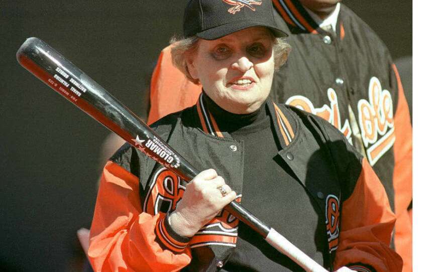 Albright holds a bat before throwing out the first pitch before the game between the Kansas City Royals and the Baltimore Orioles during opening day at Camden Yards in 2002.