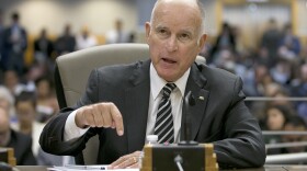 California Gov. Jerry Brown, left, responds to a question while testifying in support of Assembly Bill 398, by Assemblyman Eduardo Garcia, D-Coachella, one of two bills to extend state's cap and trade program, during a hearing of the Senate Environmental Quality committee, Thursday, July 13, 2017. 

