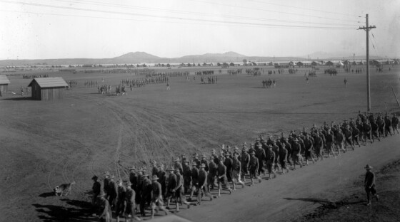 A photo of Camp Kearny in about 1918 shows soldiers marching in review.