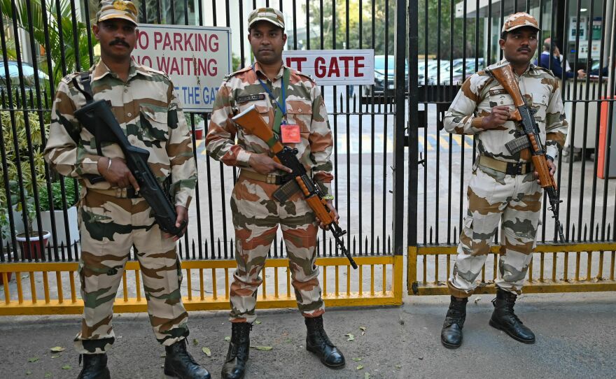 Border Police stand guard outside the office building where Indian tax authorities raided the BBC's office in New Delhi on Feb. 15.