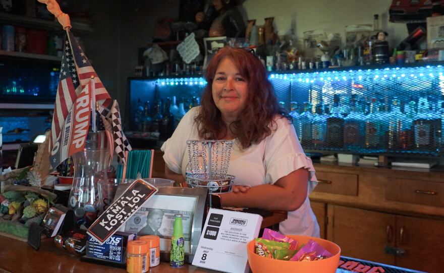 Vickie O'Haro stands behind the bar at Atomic City Bar & Store, which she owns, along with Atomic Motor Raceway, on June 8, 2026. The businesses are located near Idaho National Laboratory.