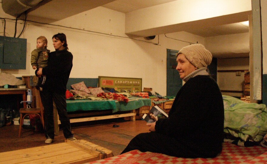 A woman sits inside a bomb shelter in Donetsk on Wednesday. Some local residents have lived in bomb shelters and basements for more than a month, looking for cover from artillery strikes.
