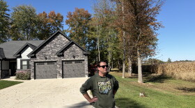 Nick Owens, an attorney in Brown County, Ohio, stands at the edge of a Mt. Orab neighborhood next to farmland that has been sold to a data center developer. Owens is leading an effort to halt the buildout of hyperscale data centers in communities like this one.