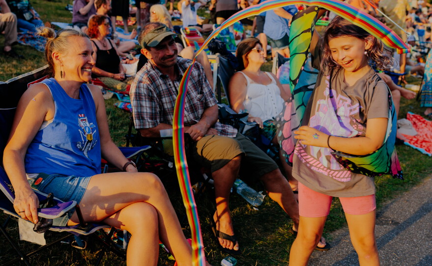 Maggie Ferguson, 9, twirls a ribbon in front of her parents Carrie, 48, and Ken, 49, at All Good Now festival at Merriweather Post Pavilion. Carrie has been a fan of the Grateful Dead, since she was a teenager and has been attending All Good Now since high school. "I just love the community, it's just so much fun. It's all positive. We've brought our daughter to festivals since she was a baby. She's very safe, she loves it, she grew up here. She's 9, she went to her first fest at 5 months old. She's a show girl for sure."