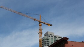 A construction crane towers over downtown San Diego. 