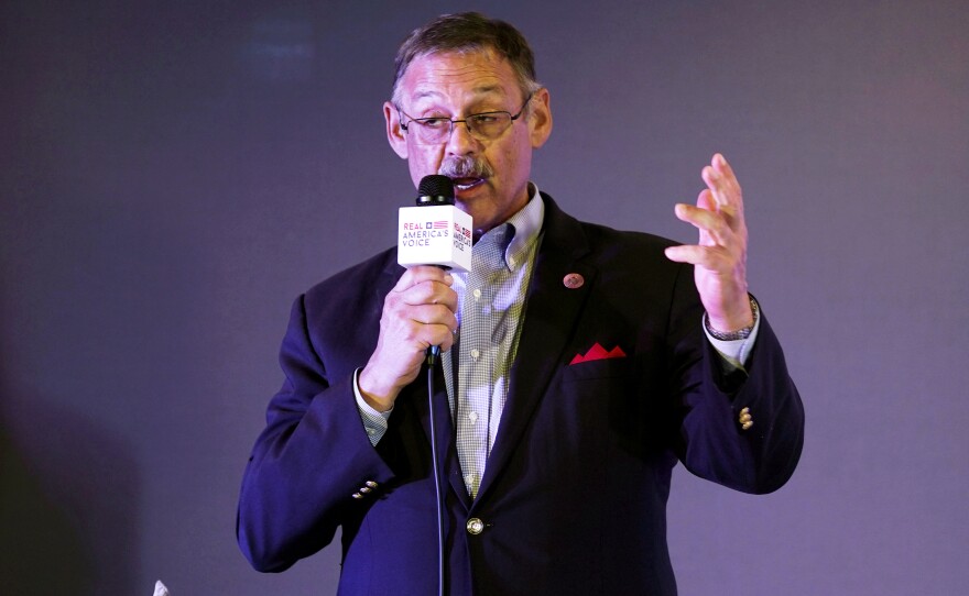 Rep. Mark Finchem, of Arizona, gestures as he speaks during an election rally in Richmond, Va., in October.