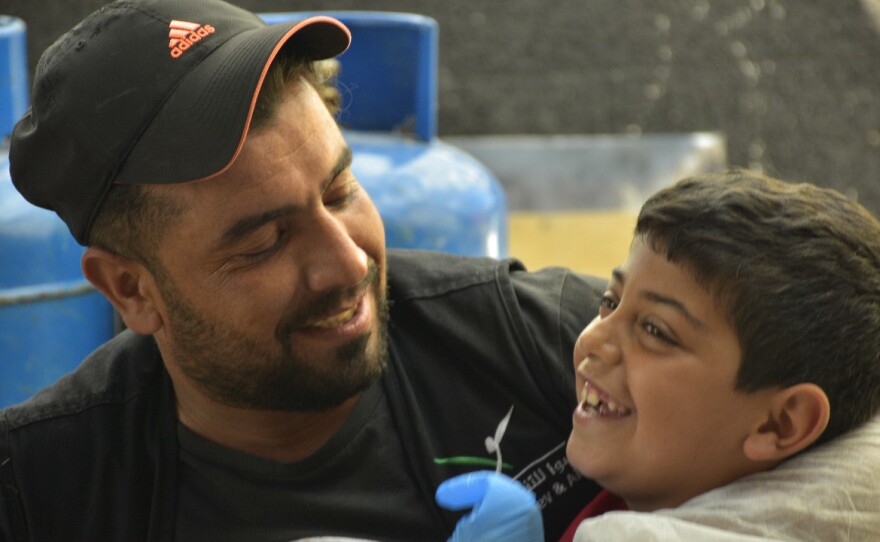 Anas, left, and Bashar, 8, bond in the Ramadan Kitchen.