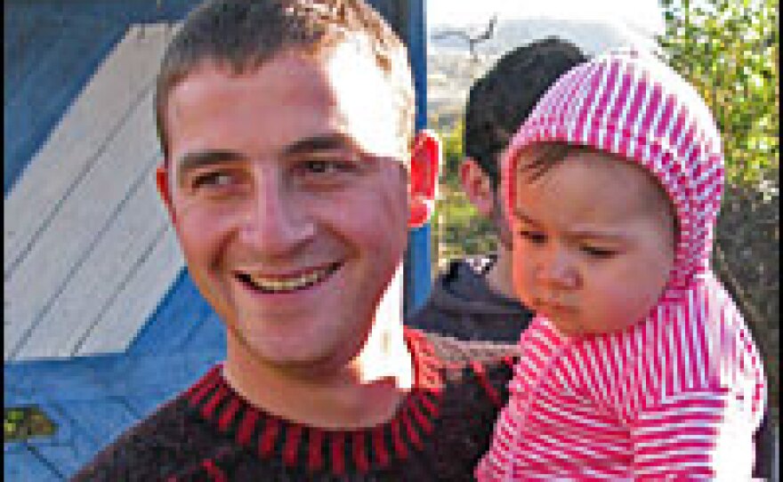 "It was the morning of Aug. 7 — we didn't even have time to eat breakfast," says Kevlishvili, shown here with his daughter. "They put us on buses and told us we were going to South Ossetia."