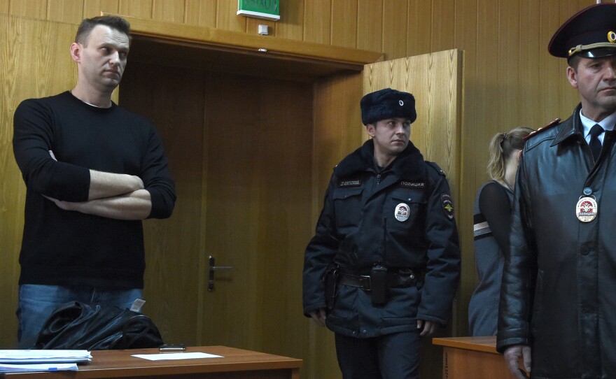 Kremlin critic Alexei Navalny (left), who was arrested during a March 26 anti-corruption rally, attends a hearing at a court in Moscow on Monday. He was sentenced to 15 days behind bars and fined Monday after he and more than 1,000 other demonstrators were detained at an anti-corruption protest in Moscow that was branded a "provocation" by the Kremlin.