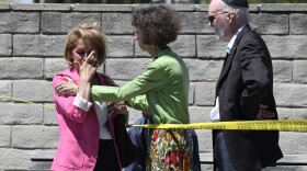 Synagogue members console one another outside of the Chabad of Poway Synagogue Saturday, April 27, 2019, in Poway, Calif. Several people were injured in a shooting at the synagogue.