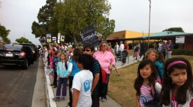 Teachers, students and others protest teacher layoffs outside Hearst Elementary School, June 12, 2012.