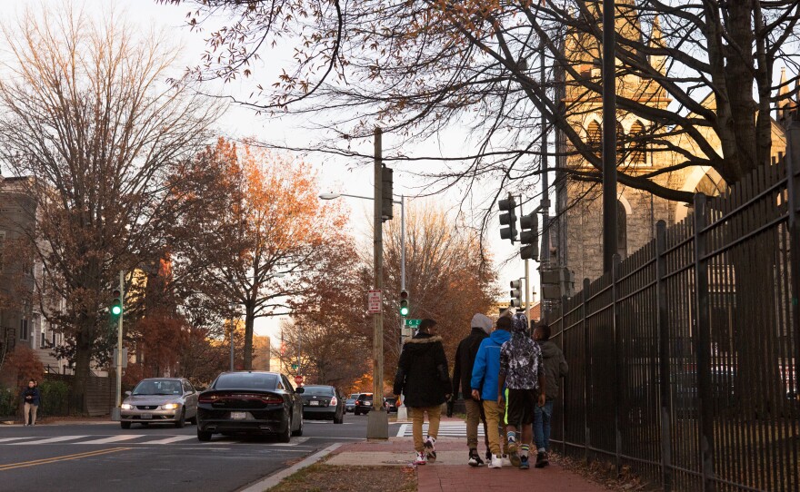 Kids walk home from school by Springfield Baptist Church in Shaw.