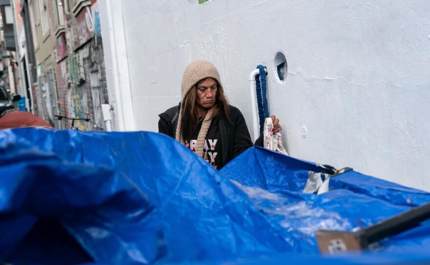 “It’s ridiculous because, if it was actually sweeping, then I’d understand, but since it’s not actually sweeping, the fuck are you moving me for? Then I got to deal with all this shit, then all the toppings you want to put on it, like getting citations, going to jail and all that. Why?” said Linda Vazquez, 52. Above, Vazquez tidies her belongings outside of her tent on Cedar Street in San Francisco on Nov. 19, 2024.