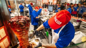 Cooks in the kitchen at Tijuana’s Legendary Tacos El Franc