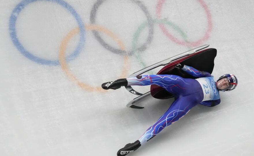 Summer Britcher, of the United States, was one of several racers who crashed during the luge women's singles run at the Beijing Winter Olympics on Monday, Feb. 7, 2022.