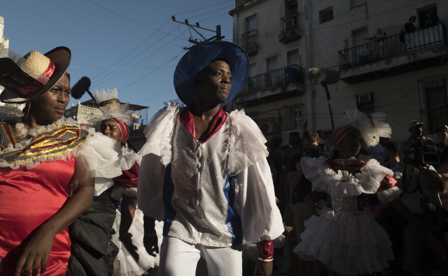 In the streets of Old Havana, Cuban dancers perform to a conga played by New Orleans musicians during a jazz festival.