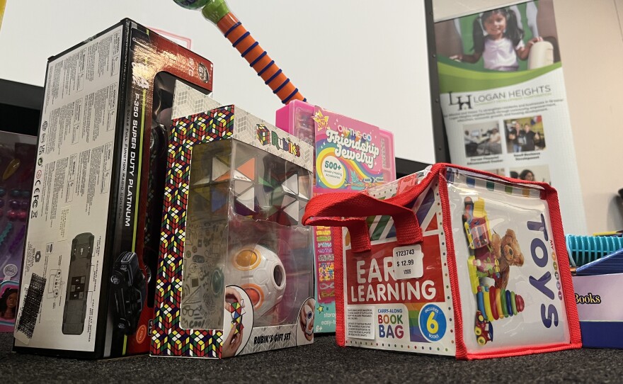A pile of toys lays on the ground at Logan Heights Community Development Corporation, Dec. 2, 2025.